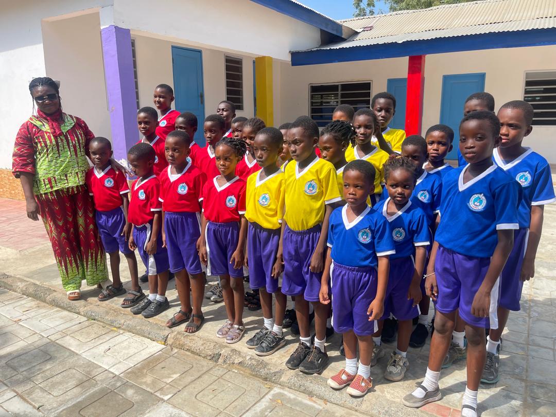 ROSA pupils and a staff member together outside a school building